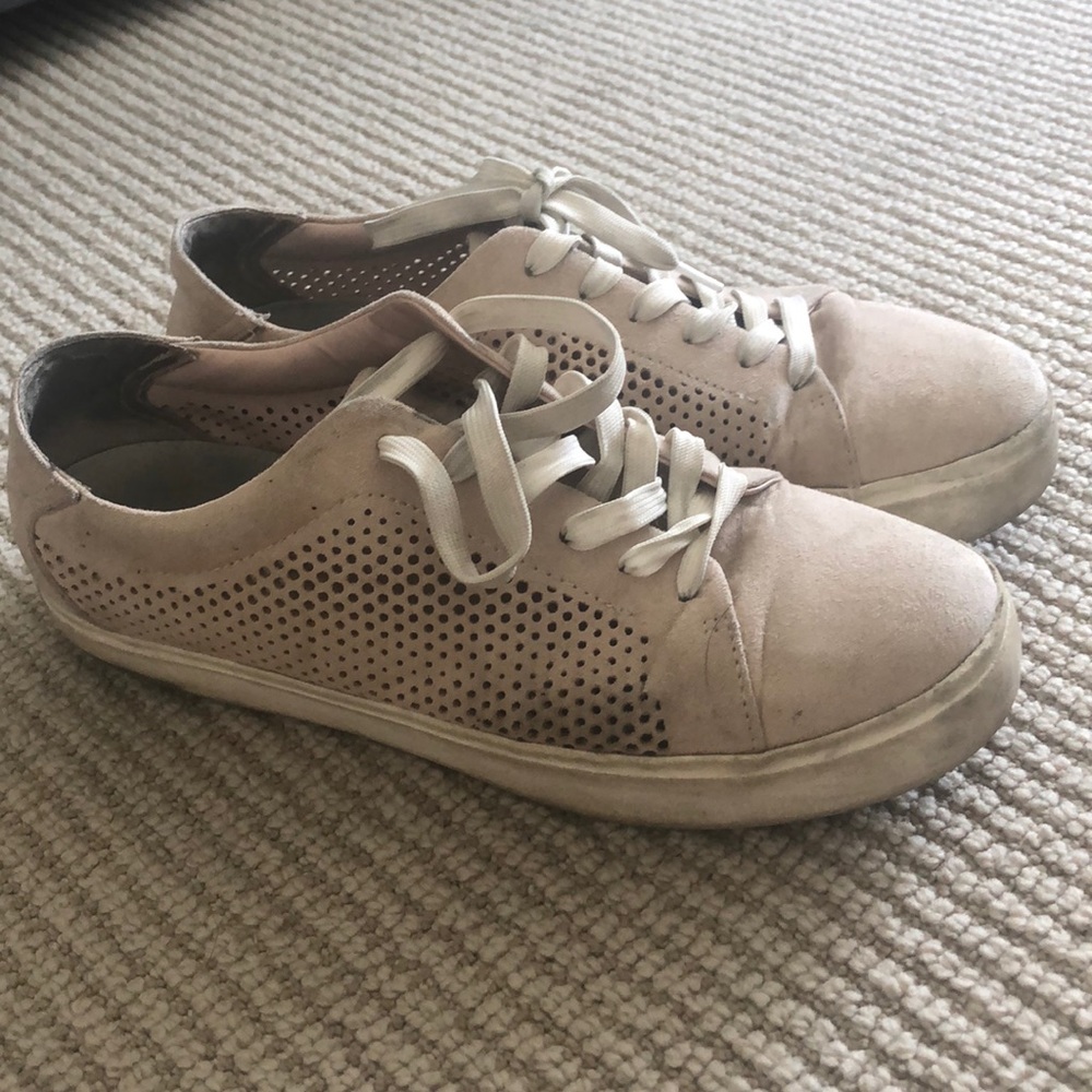 worn pink sneakers
